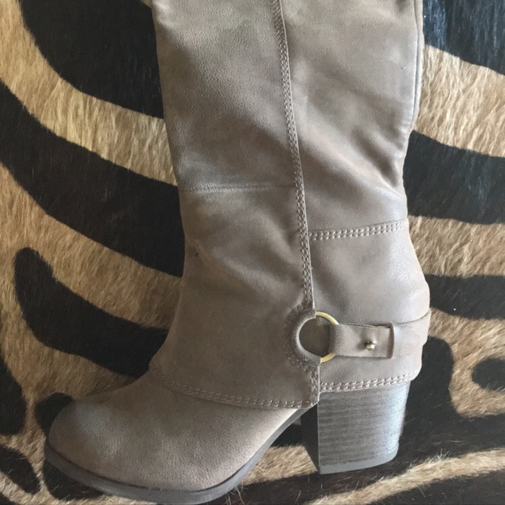 Grey knee high boots.